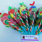 Assorted festive colorful  sweets and candy cane. The perfect party bag fillers, Christmas sweet for kids and anyone young at heart.